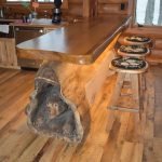 Tree island with bear carving