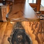 Tree island with bear carving